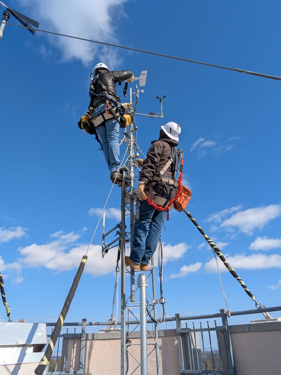 Tower climbers servicing weather instruments at Blue Hill Observatory